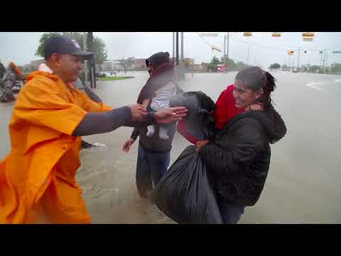 "We had to leave before we got trapped." Volunteers rescue residents in Harris County, Texas.