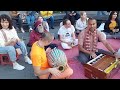 Godruma prana prabhu chants hare krishna at washington square park and guy plays shakers and dances