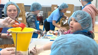 Crosslake Community School Helps Pack Meals to Feed the Community | Lakeland News