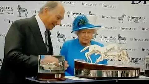 Queen Elizabeth presenting Winner's trophy to Aga ...
