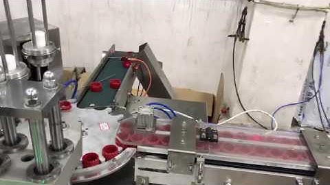 cap closing folding lining liner inserting wadding machine