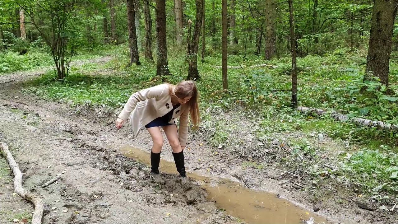 Muddy high heels boots stuck, boots in mud, girl is walking in mud
