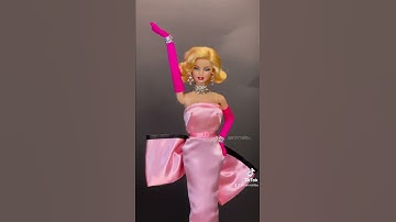 Thumbnail of Marilyn Monroe’s “Diamonds Are a Girl’s Best Friend” pink dress (doll version)