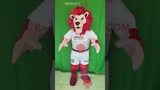 Red-Maned Lion Redbrokoly Mascot Wearing A White Sports Outfit With Red And Maroon Accents