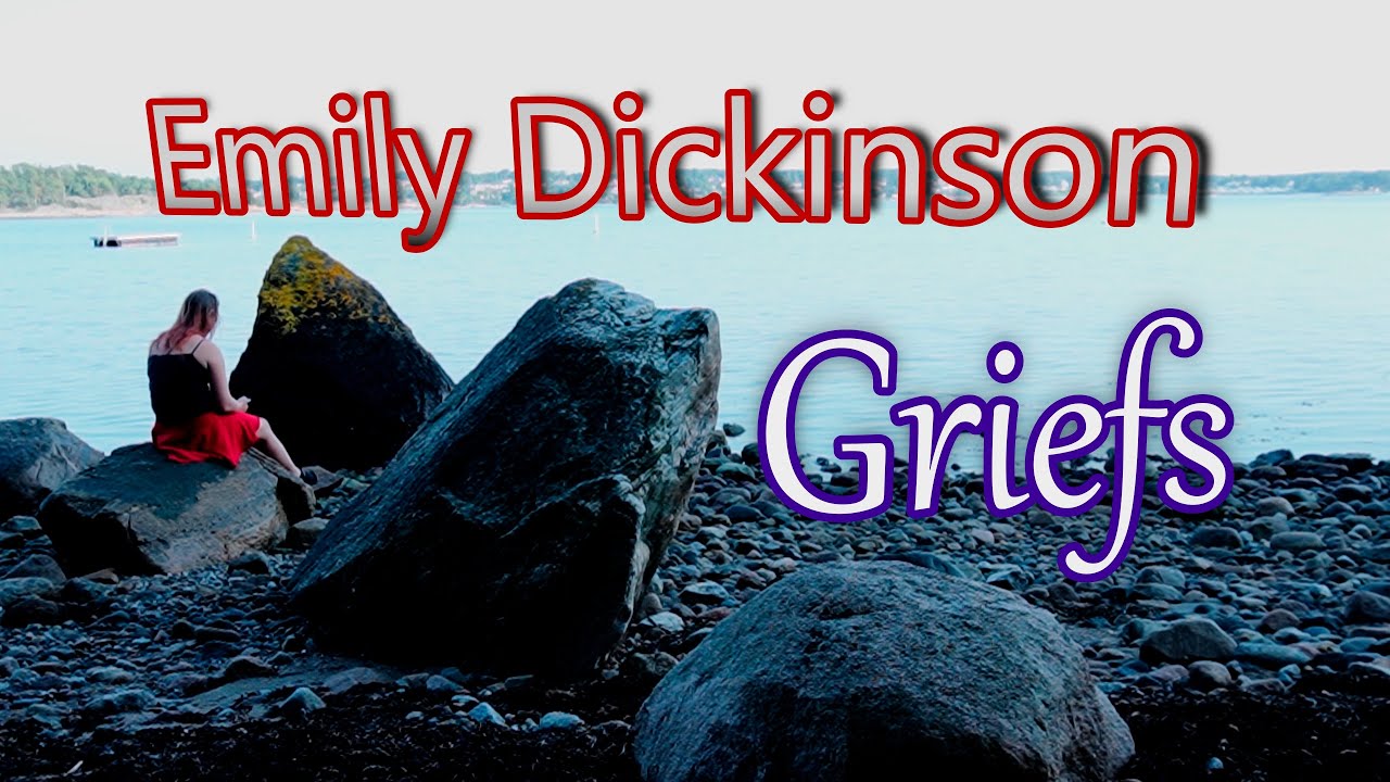 Woman reads Griefs by Emily Dickensen alone by the ocean