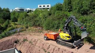 Mecalac 6 mcr pulling 4 ton trailer a 40 % slope