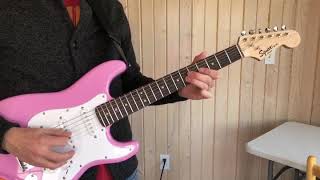 Playing a Pink Fender Squier Mini Stratocaster