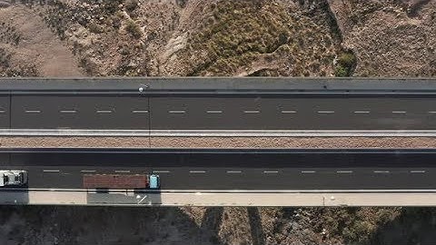 Top View on the Highway with Trucks Near the Warehouse Terminal | Stock Footage - Videohive
