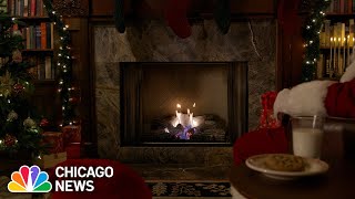 Fireplace lights up with Yule log with holiday tunes and Santa  1 hour long