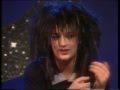 boygeorge talks with black hair.