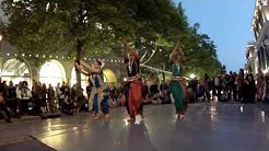 Odissi dancers performing in the street.