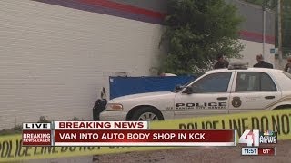 Homicide investigation underway after body found between van, wall in KCK wreck