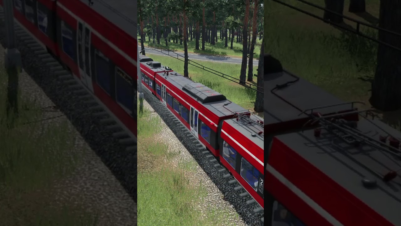 Regionalbahn unterwegs auf dem Land – zwischen Feldern und Landstraße zieht sie ruhig ihre Bahn