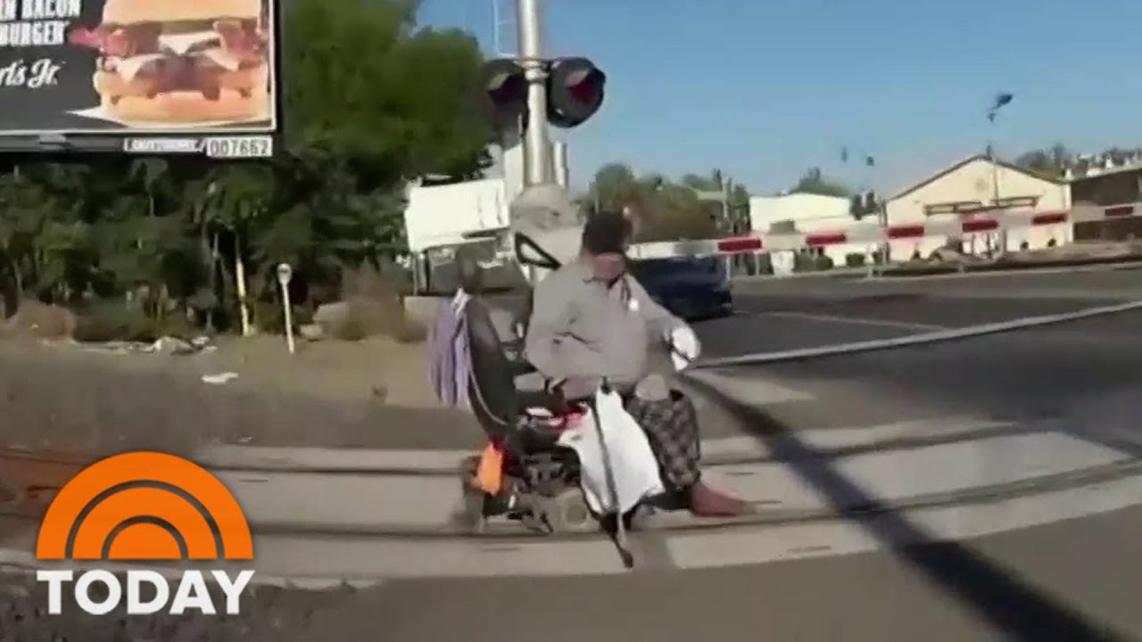 Officer Who Saved Man With Wheelchair From Train Speaks Out