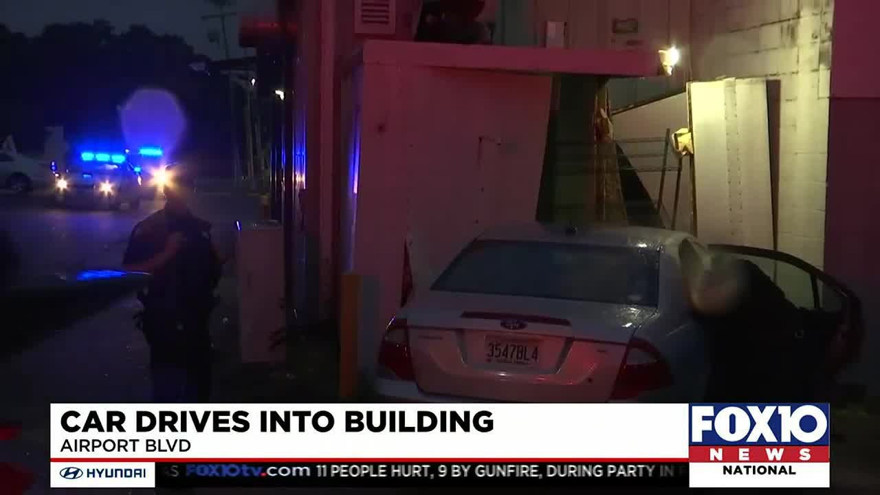 Car crashes into building on Airport Boulevard - YouTube