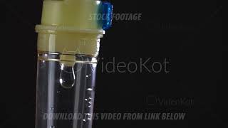 Download Lagu Drops of medical liquid are falling down inside of infusion machine in macro in flash police signal MP3
