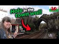 The railway goes through this town wall  visiting every station on the north wales main line