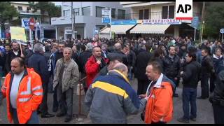 Transport workers demonstrate against layoffs, pay cuts