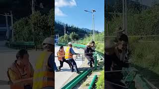 Workers Install Highway Guardrails Together With Simple Teamwork and Smart Coordination