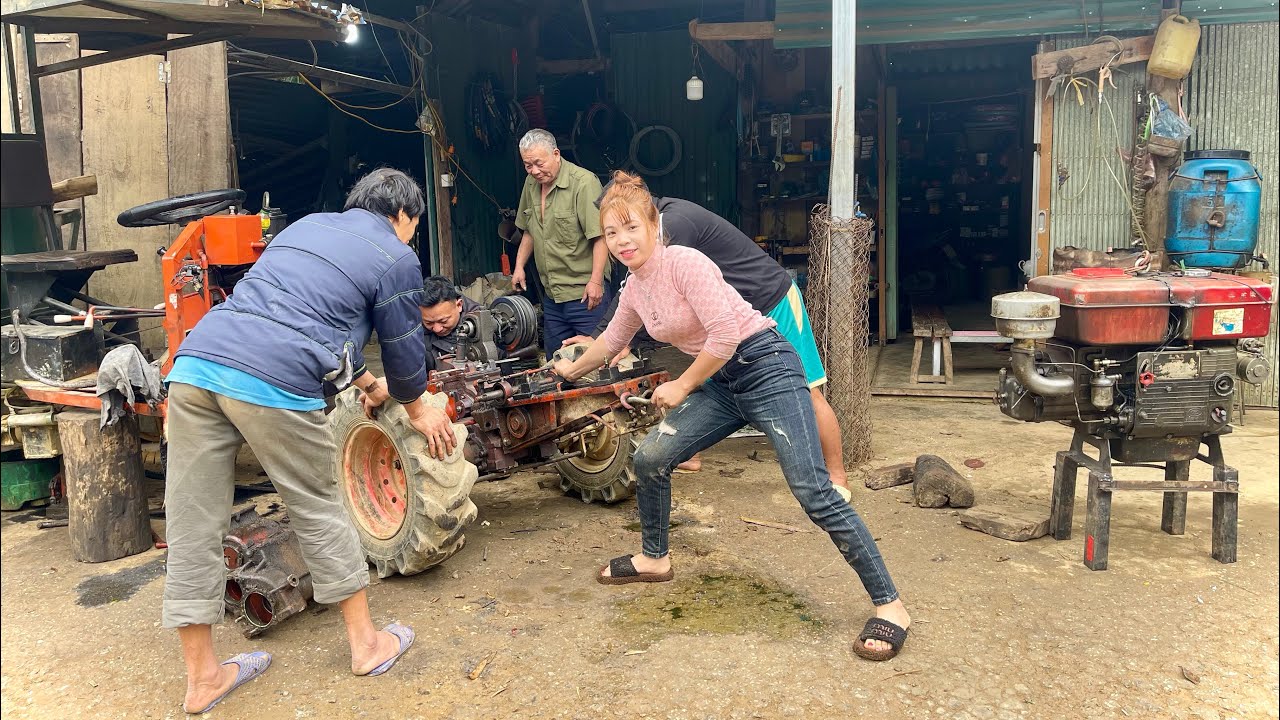 Tractor repair girl changes new gearbox