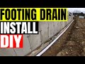 Installing footing drains Tri-County Masonry & Excavating 'Dirt Boss'