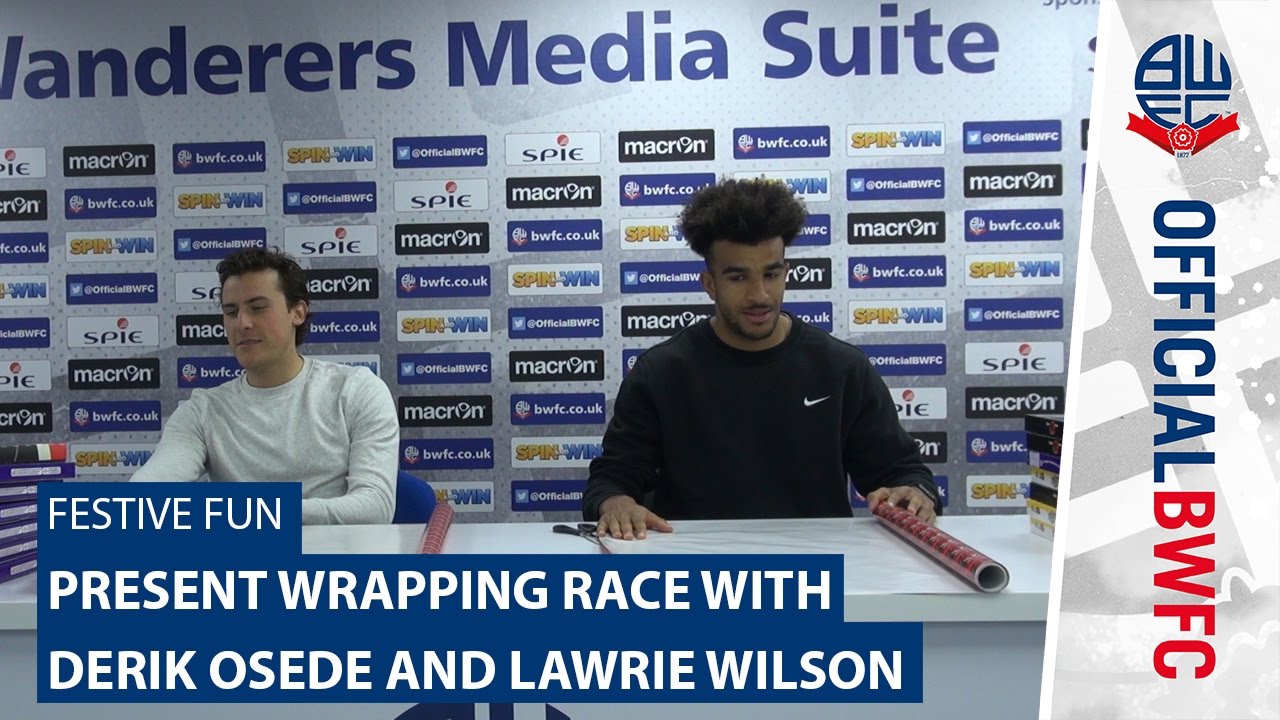 FESTIVE FUN | Present wrapping race with Derik Osede and Lawrie Wilson football score