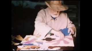 Footage of Henri Matisse making a paper cut out