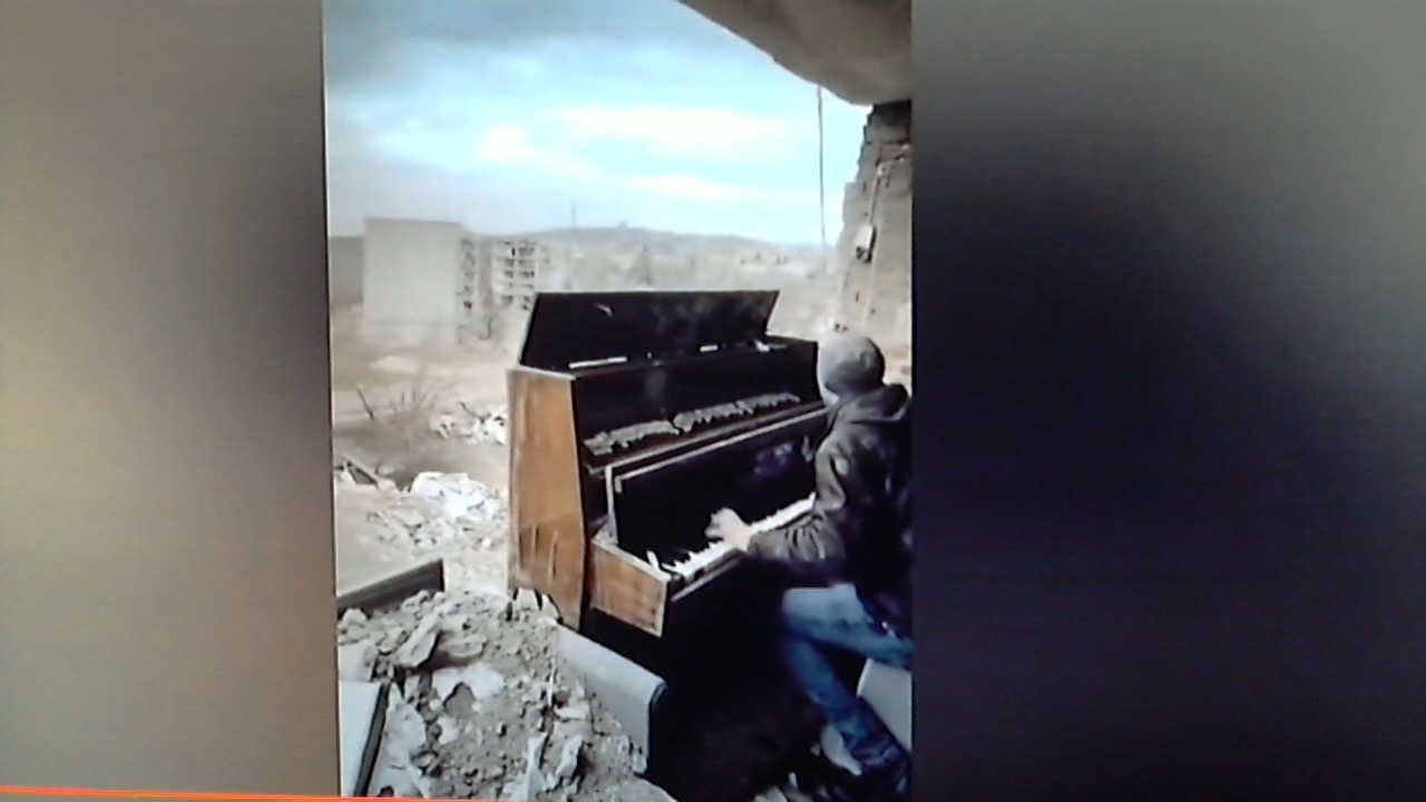 Pianist plays The Piano in a Bombed Out High Rise Building in the Ruins of Kharkiv
