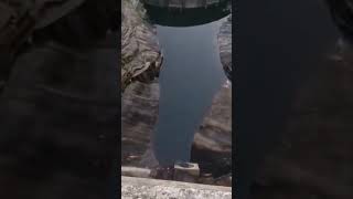 Throwing Large Rock Off Dam