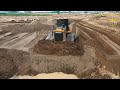 Giant bulldozers in action - Shantui Bulldozer pushing sand - bulldozer clearing land