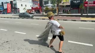 Friends do the 'durian dance' all the way to the bank