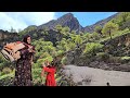 Nomads of Iran: washing blankets by the river by a nomadic family