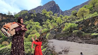 Nomads of Iran: washing blankets by the river by a nomadic family
