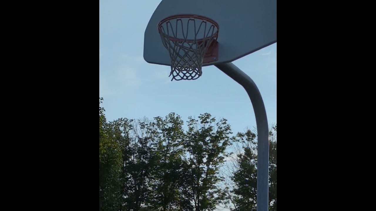 The basketball got stuck in the net