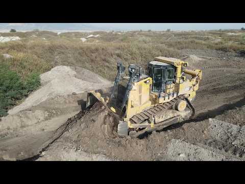 Caterpillar D9T And Komatsu D275AX Bulldozers Rehabilitating An Old Mining Area