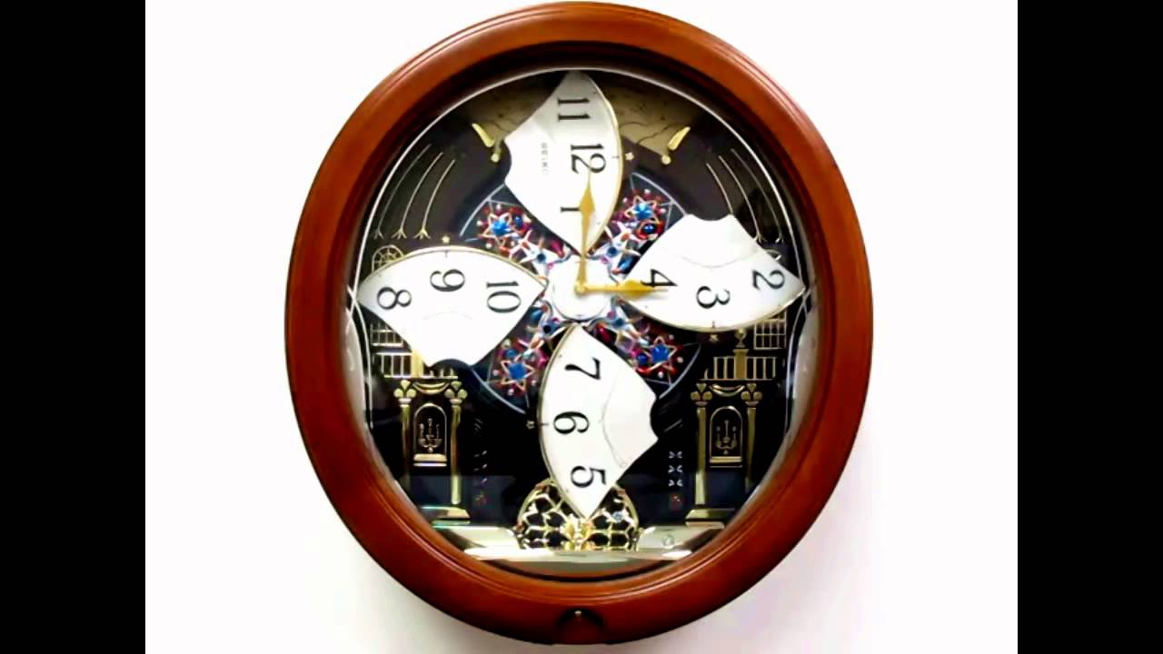 QXM478BRH Seiko Melodies in Motion Pendulum Wall Clock - YouTube