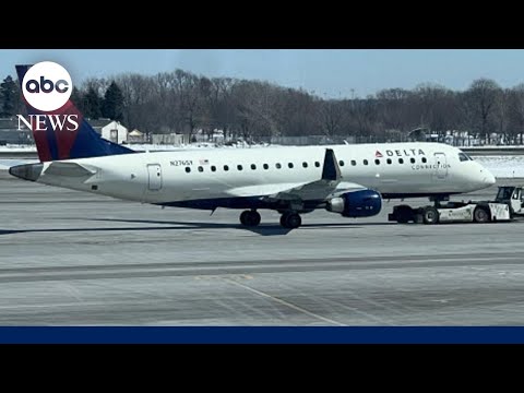 Delta planes clip wings on Minnesota tarmac