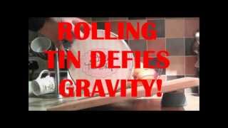 Round tin defies gravity by rolling uphill