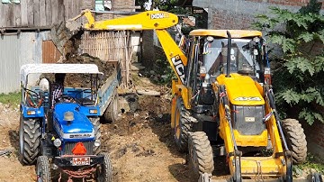 JCB Machine Loading Mud in Tractor - JCB Backhoe Digging Field For Home Construction