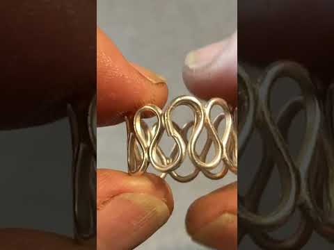 making a silver wire ring on a bending jig tool.