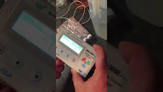 Geiger counter testing uranium ore radioactivity