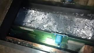 Shuffle conveyor (not vibratory) handling steel stamping scrap