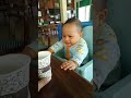 bayi berusaha ngambil minum