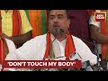 Suvendu adhikari addresses a press conference as bjp stages protest with placards in bengal assembly