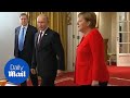 Vladimir Putin joins Angela Merkel for a G20 breakfast meeting