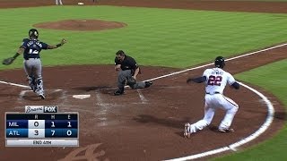 Braun throws out Heyward at the plate