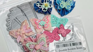 Butterfly embellishments and heart rosettes