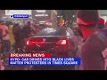 Car drives through Black Lives Matter protesters in Times Square