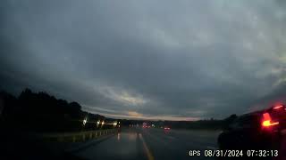 Car missed exit and stopped in third lane.