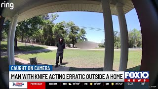 Caught on camera: Man bangs on door yelling, holding a knife